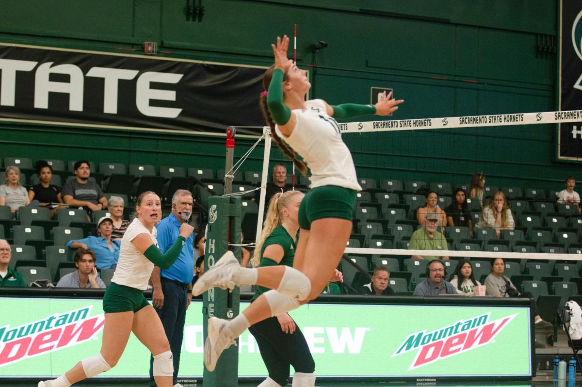 Victoria Marthaler goes up to attack the ball against Weber State Saturday, Sept. 27, 2025. The win against the Wildcats was the first of their two conference wins. 