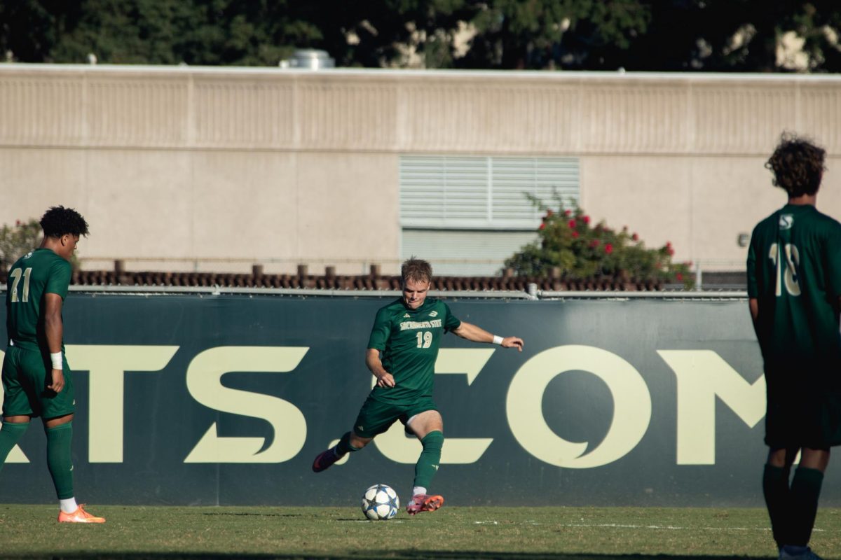 Junior forward Zac Giles sends in a freekick in a match at home against CSU Bakersfield, Wednesday, Oct. 1, 2025. Sac State fell short of their comeback efforts by a score of 1-0.