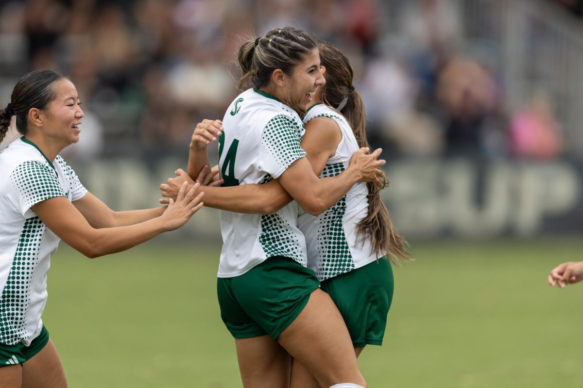 Junior forward Lexi Schroeder is embraced by her teammates after her goal saved the Hornets from defeat against Big Sky conference opponents Northern Arizona Sunday, Sept. 28, 2025. Schroeder has been an integral piece of the Sacramento State women’s soccer attack squad.