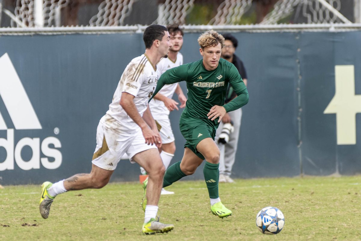 Sophomore forward Eli Reyneveld keeps the pressure on the backline of Cal Poly, Wednesday, Oct. 15, 2025. Sacramento State drew with the Mustangs after scoring an early goal. 

