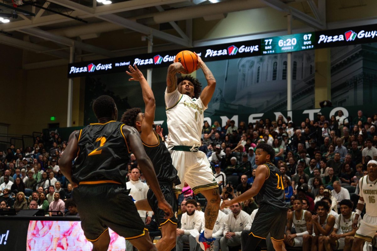 Sophomore guard Mikey Williams attempts a shot against Dominican Tuesday, Nov. 5, 2025. Williams finished the game with 10 points and six assists.