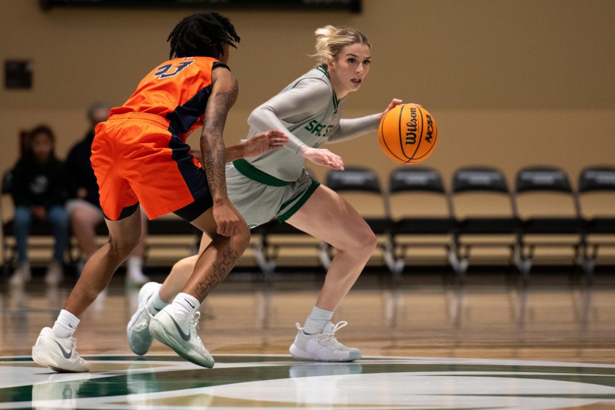 Redshirt senior guard Benthe Versteeg attempts to pass by a Cal State Fullerton defender midcourt on Friday, Nov. 21, 2025. Versteeg led the team with seven assists, contributing to a 78-58 landslide victory.