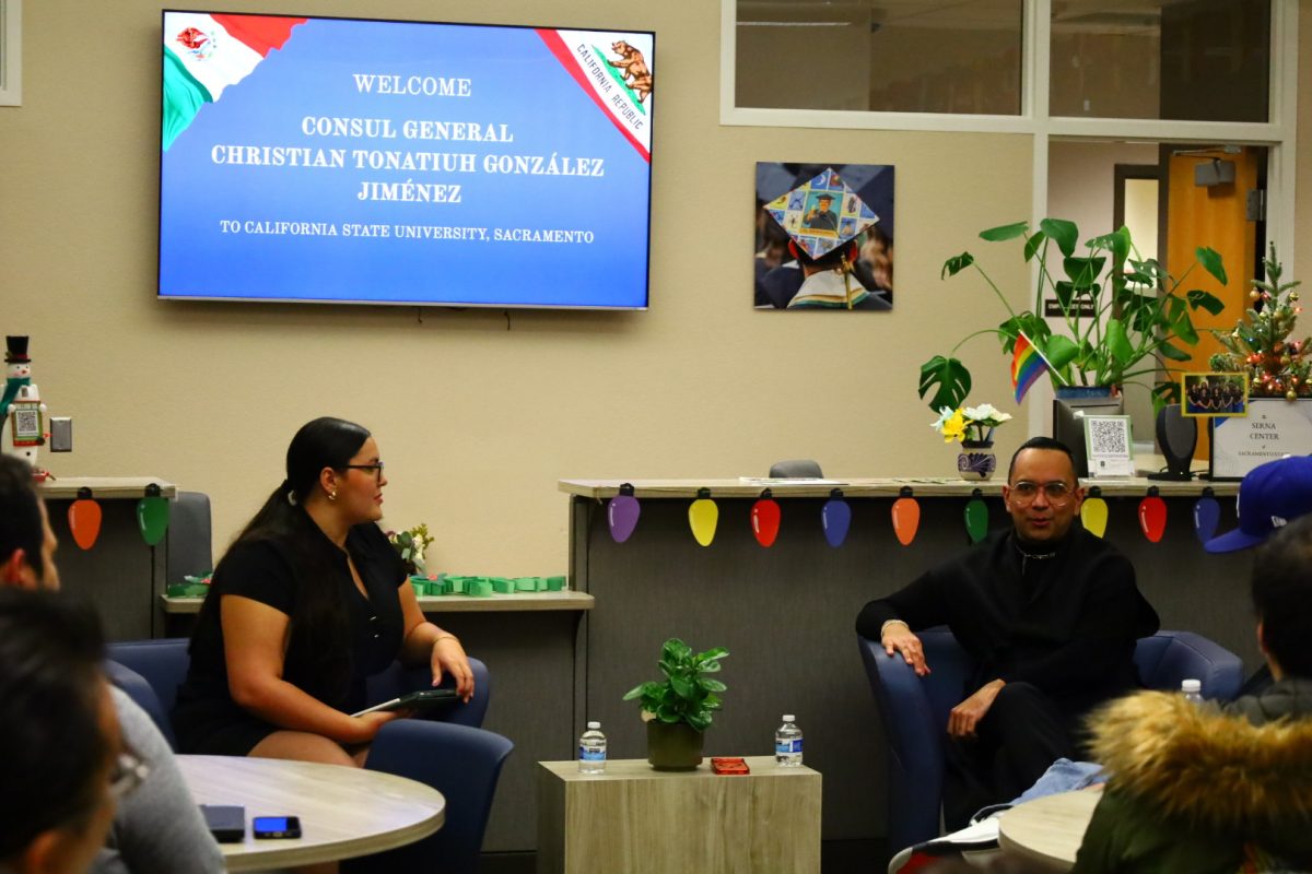 Aryanna Chico, director of global English at the Society of Foreign Affairs, speaks with Christian Tonatiuh González Jiménez, Consul General of Mexico in Sacramento, during a diplomacy forum at Sacramento State Tuesday, Nov. 19, 2025. González led a discussion on public service, diplomacy and global cooperation.