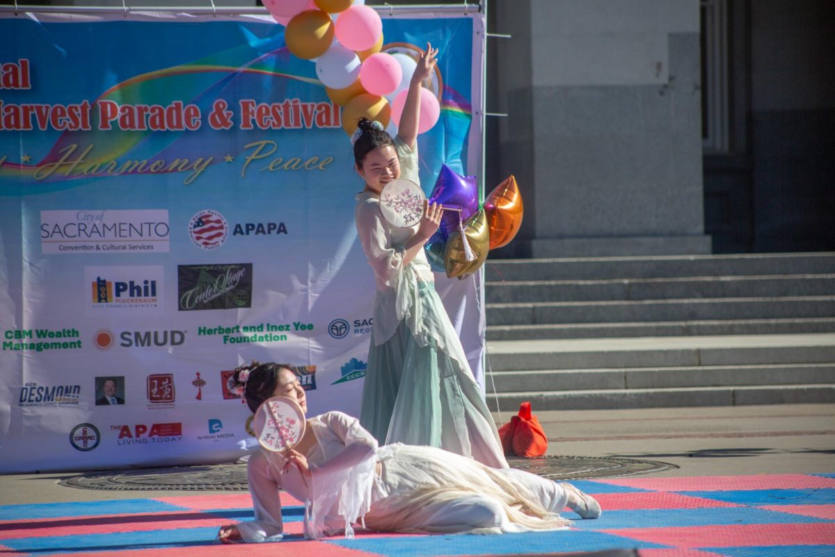 Stage performers striking the final pose of their traditional Chinese dance routine Saturday, Nov. 1, 2025. They were among 22 other stage performance groups attending the festival.