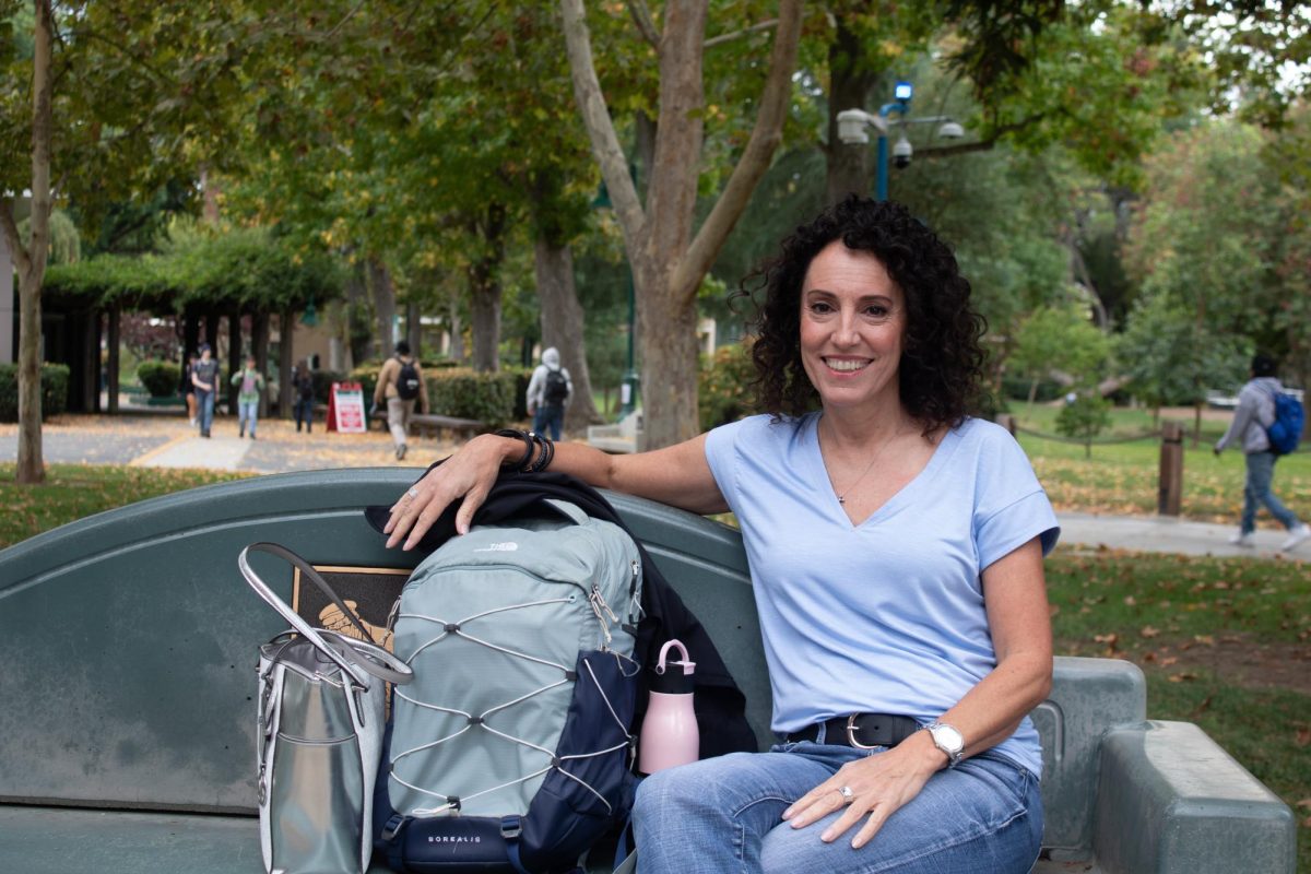 Suzi Perri sits on a bench at Sacramento State Friday, Oct. 24, 2025. After 35 years in law enforcement, including time as an undercover agent, Perri returned to the university to finish the theater degree she once left behind.