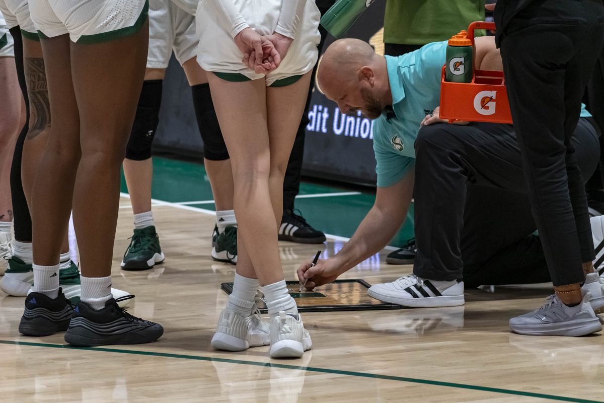 Head coach Aaron Kallhoff draws up a play in overtime against Davis Monday, Nov. 24, 2025. The Hornets struggled with turnovers throughout, turning the ball over 22 times in the contest. 