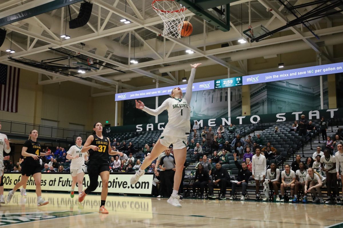 Redshirt senior Benthe Versteeg jumps high to the rim against the Idaho Vandals on Thursday, Jan. 24, 2026. Versteeg made history against the Vandals, reaching 1,000 career points becoming the 19th Hornet to do so.