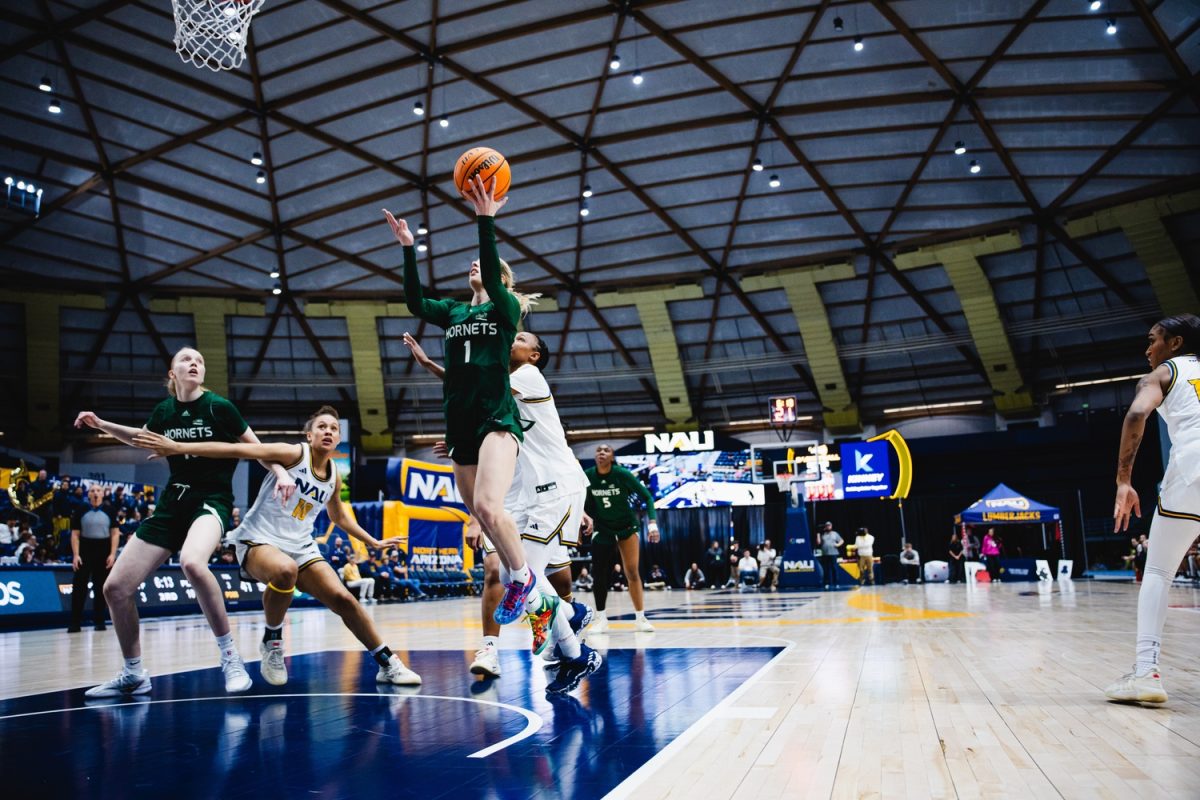 Redshirt senior guard Benthe Versteeg jumps up for a layup against Northern Arizona University defenders Thursday, Jan. 15, 2026. Versteeg tallied 18 points, second behind sophomore guard Rubi Gray, who combined for 44 for the victory. (Photo courtesy of Jyanne Bautista)