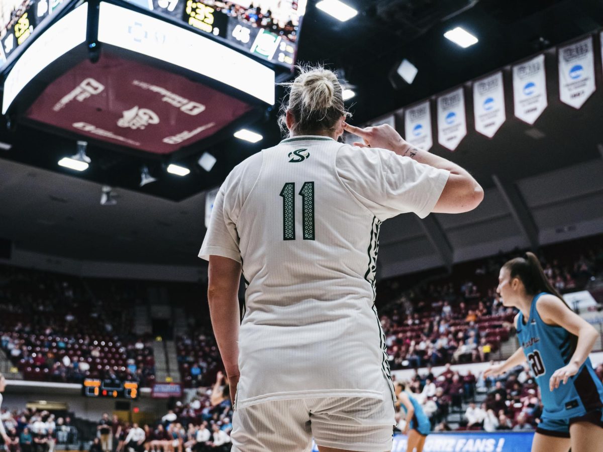 Sophomore guard Rubi Gray holds her finger to her ear, silencing the crowd in Montana’s own arena on Saturday, Jan. 31, 2026. Gray scored 18 points, one of three Hornets to score in double digits against the Griz. 
