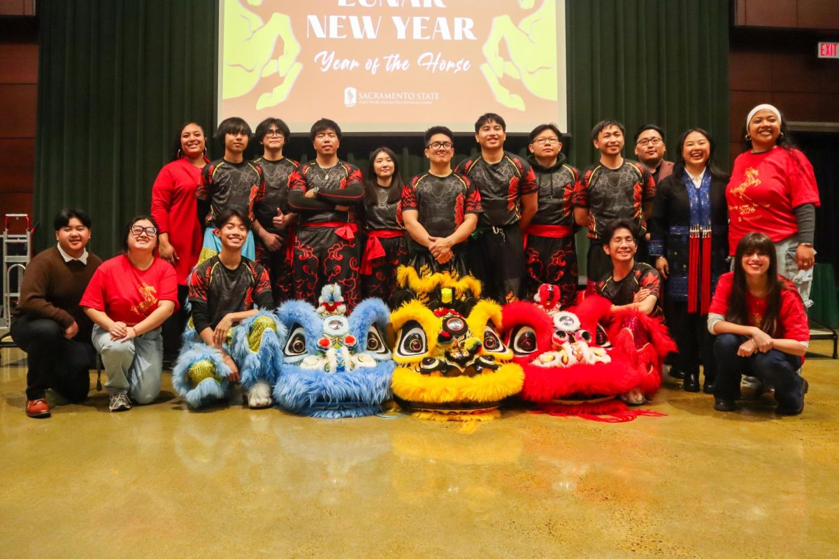 APIDA Center staff and Red Lotus Lion Dance team stand for a photo after the cultural performances came to a close Feb. 17, 2026. Red Lotus performed two routines during their allotted time.