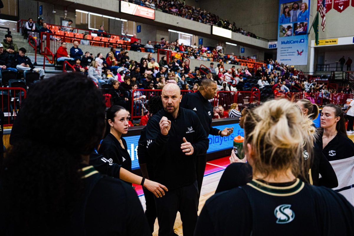 Head coach Aaron Kallhoff stands with his team surrounding him during a timeout on Thursday, Feb. 19, 2026. The Hornets went on to win 69-60 against the EWU Eagles. (Photo courtesy of Jyanne Bautista)