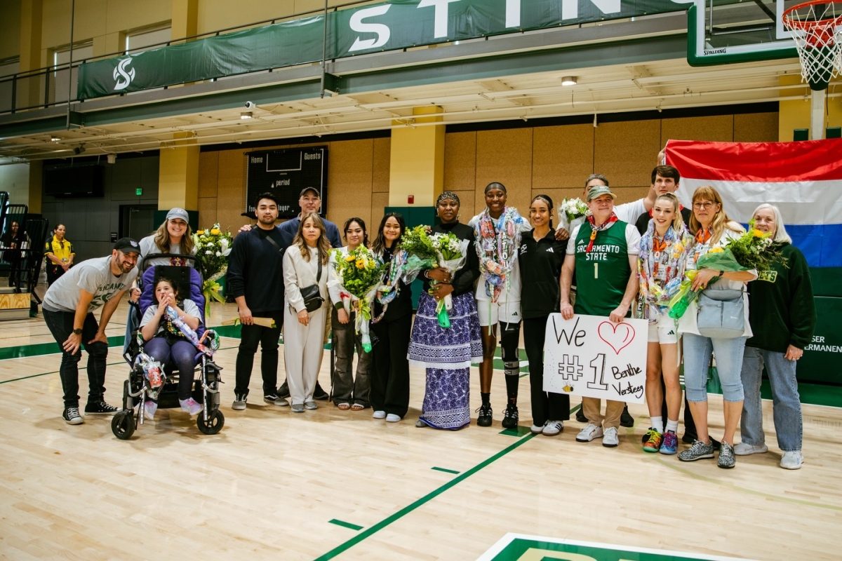 Sacramento State senior forward Fatoumata Jaiteh and redshirt senior Benthe Versteeg gather with their family to celebrate Senior Day Saturday, Feb. 28, 2026. Versteeg tallied nine assists, while Jaiteh recorded 10 rebounds against Montana State. 
