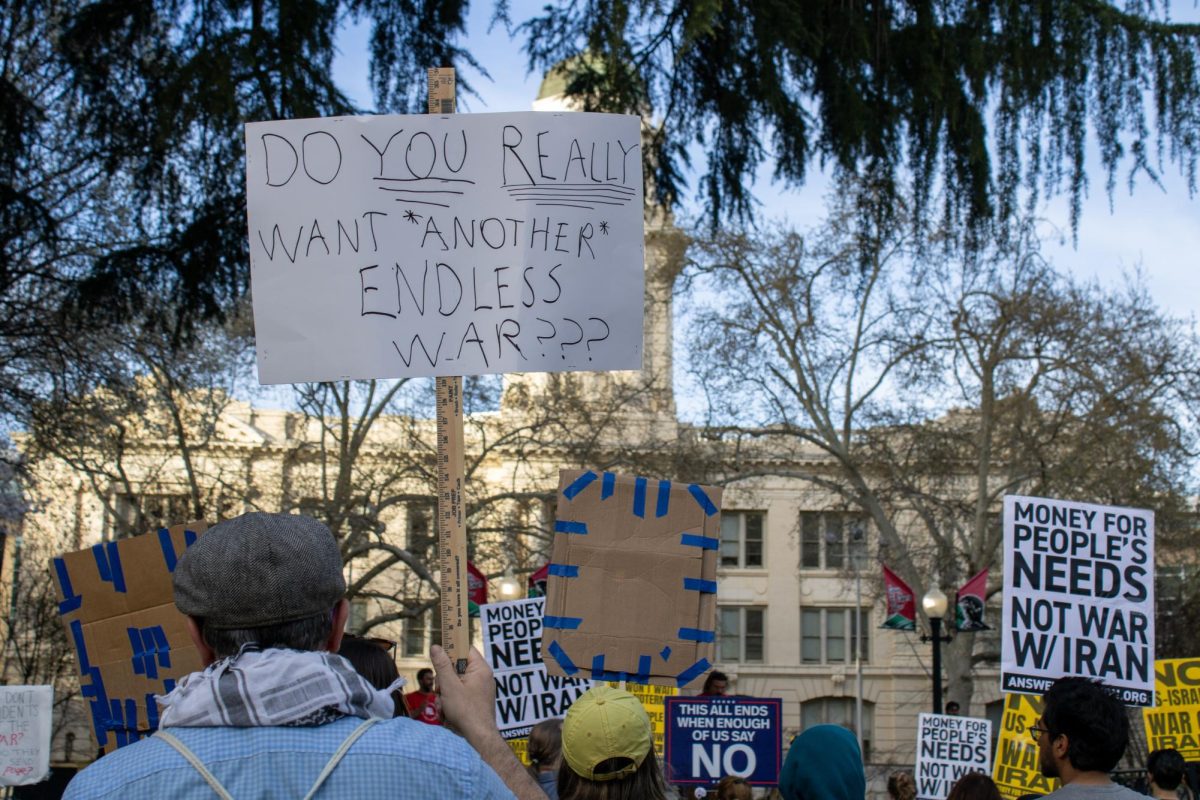 A protest against the conflict with Iran at Cesar Chavez Plaza in Downtown Sacramento Saturday, March 7, 2026. The U.S. military efforts against Iran are opposed by 56% of Americans, according to polls from Reuters and PBS.