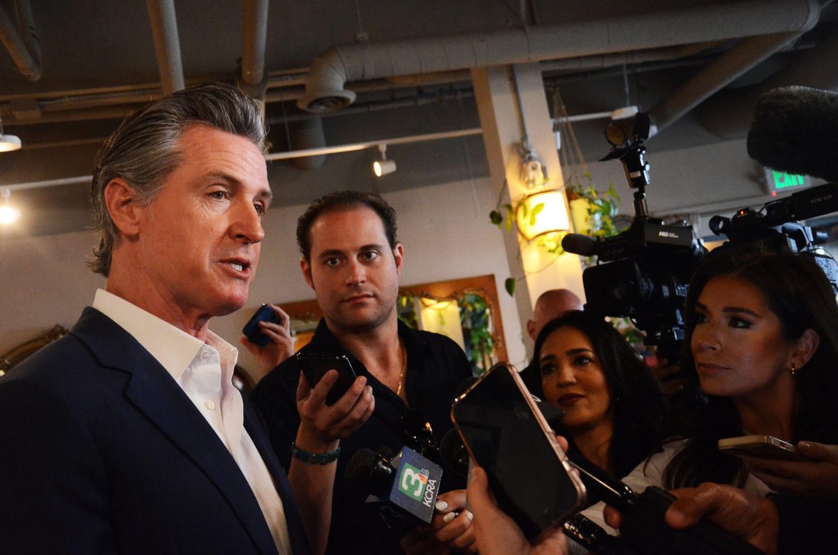 Journalist John Ferrannini takes an interview from Gov. Gavin Newsom. Ferrannini graduated from Sacramento State in 2018 with a bachelor’s degree in journalism and mass communications with a philosophy minor. (Photo courtesy of John Ferrannini)