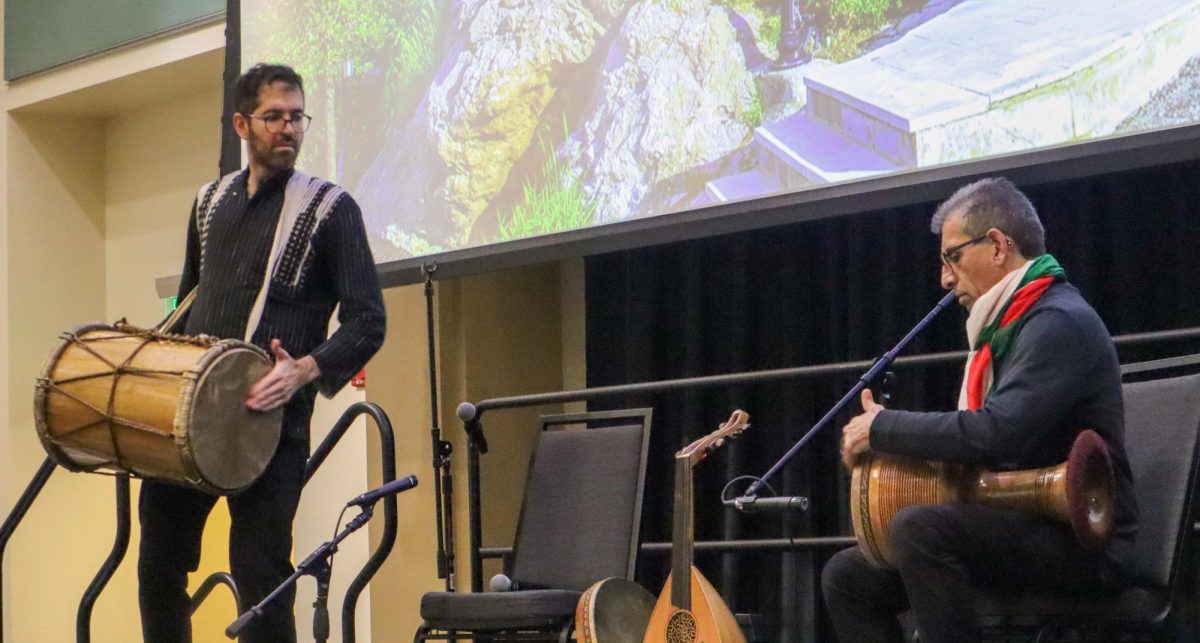Nariman Assadi (left) plays the dammam instrument alongside his companion, who is playing a single-faced drum at the SWANA Center’s “Kickoff: Cultural Showcase” Monday, April 6, 2026. The dammam is a double-headed cylindrical drum and is used in religious ceremonies in Iran and Iraq.