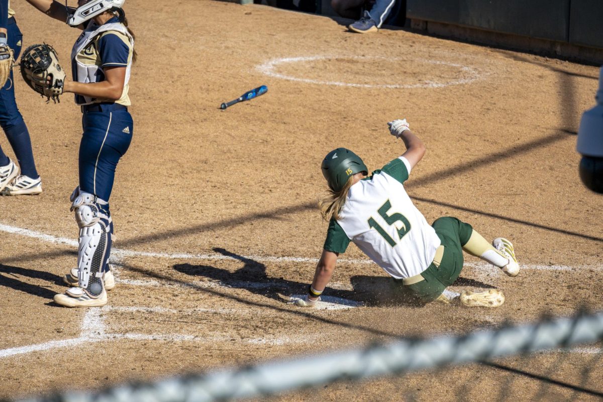 ophomore outfielder Saskia Raab slides in to score another run for the Hornets against UC Davis Tuesday, March 24, 2026. Raab is batting a .350 average for the Hornets and is becoming a key batter in the lineup. 
