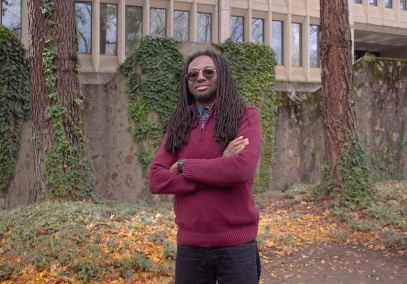 David Player poses for a picture in front of Eureka Hall on Feb. 18, 2026. Eureka hall is the main building on campus for Deaf studies.
