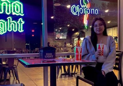 Stephanie Cornejo, a third-year communications major at Sac State sits outside of El Favorito Taqueria on Oct. 3, 2022. Cornejo says she enjoys sitting in the patio area while sipping on an an agua fresca. 