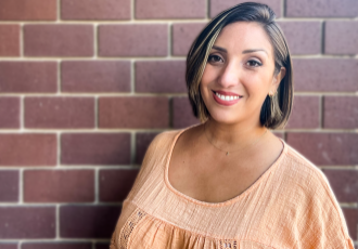 Sacramento State alumna Angela Chavez poses for a photo on the patio at Old Soul Coffee in Oak Park on Oct. 7, 2022. Chavez runs the non-profit Chicas Latinas de Sacramento which focuses on educating the community through civic engagement and cultural leadership.