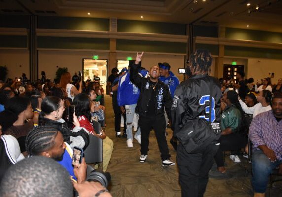 Alumnus Dennis Mundy leads Omicron Eta chapter of the Phi Beta Sigma fraternity to the stage for their performance at Black Org Night in the University Union Ballroom Friday, Sept. 22, 2023. Students in the crowd recording with their phones are shocked by Phi Beta Sigma’s energy.